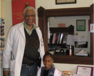 Dr. Tolbert Small with patient at the Harriet Tubman Medical Office